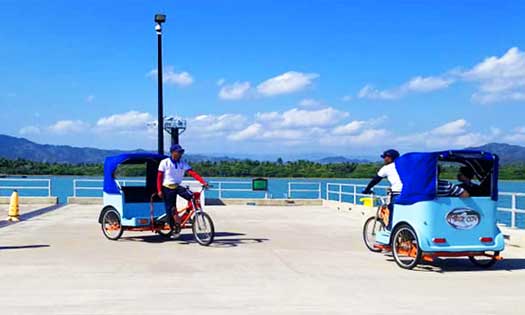 Bicycle‑Rickshaws Amber Cove Cruise Ship Port Photo of bicycle rickshaws